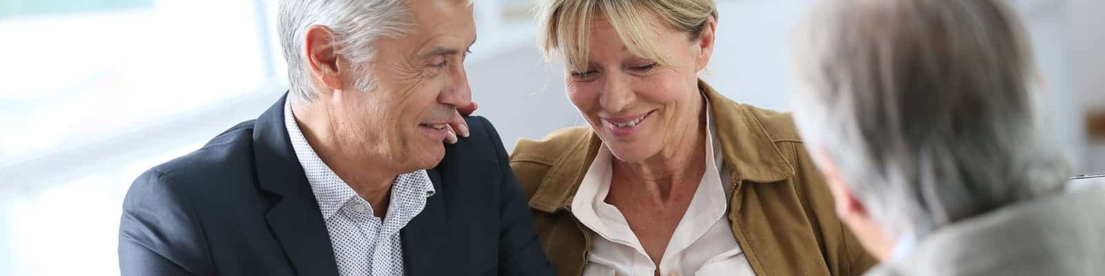 Senior couple meeting real-estate agent for investment